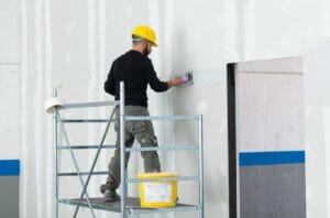 Worker plastering