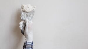 Worker performs plastering